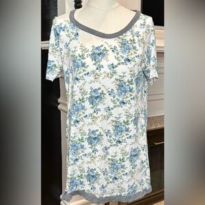 Chaser distressed floral top